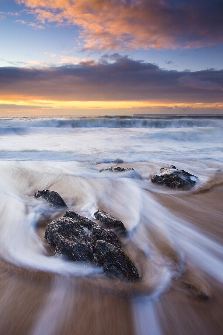Incoming waves at sunset, Hope Cove, South Hams, Devon, England, United Kingdom, Europe