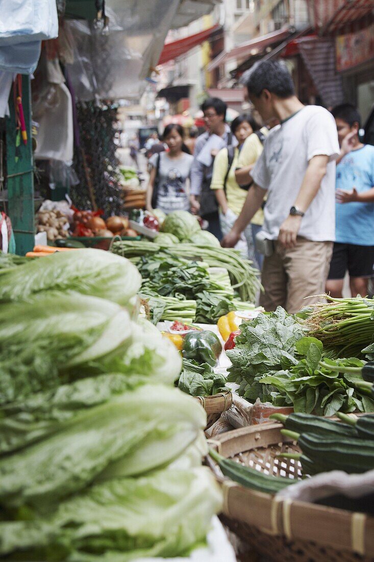 People buying vegetables at Graham Street market, Central, Hong Kong Island, Hong Kong, China, Asia