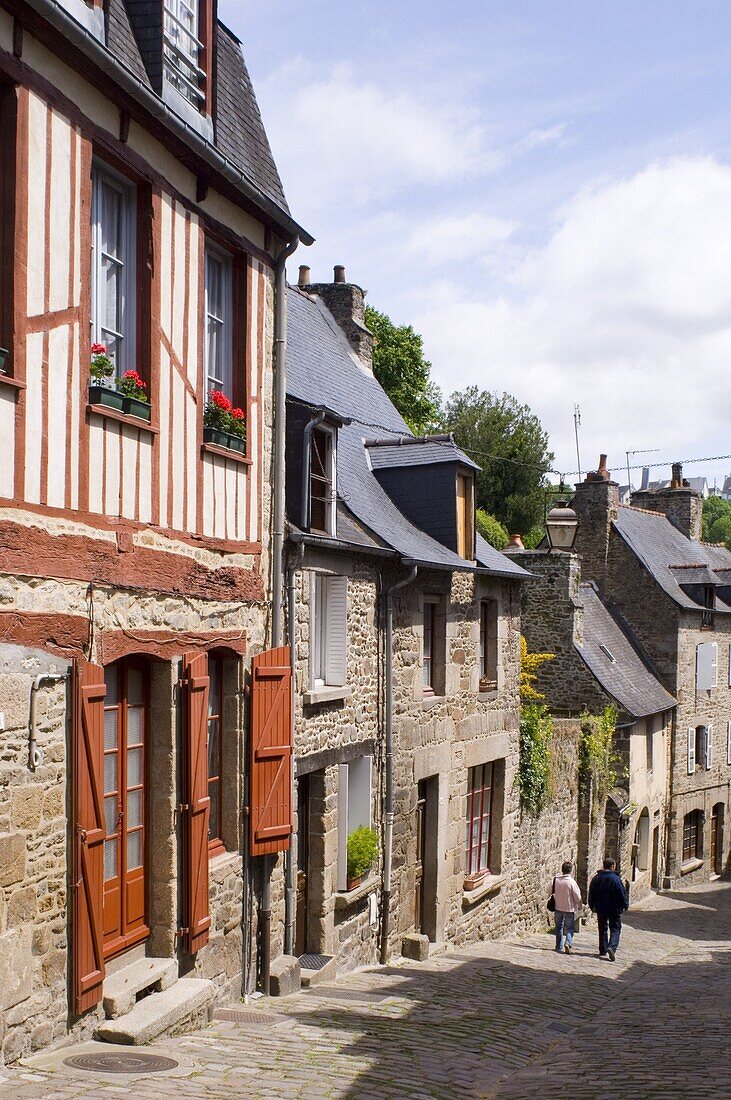 Old half timbered and stone buildings in the picturesque village of Dinan, Brittany, France, Europe