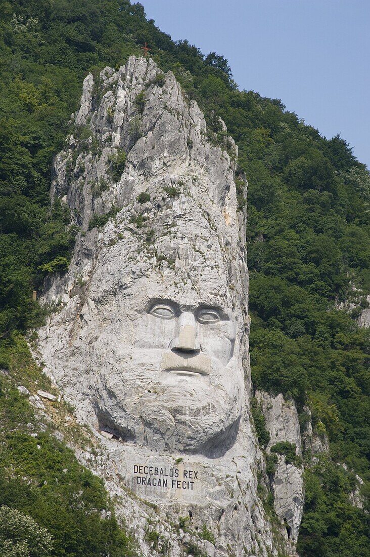 A rock sculpture of Decebalus, last prince of the Dracinians, on a hillside in the Kazan Gorge area of the Danube River, Romania, Europe