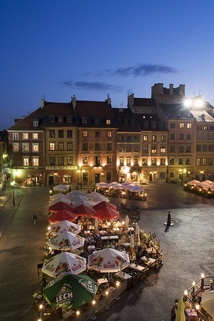 Elevated view over the square and outdoor restaurants and cafes at dusk, Old Town Square (Rynek Stare Miasto), UNESCO World Heritage Site, Warsaw, Poland, Europe