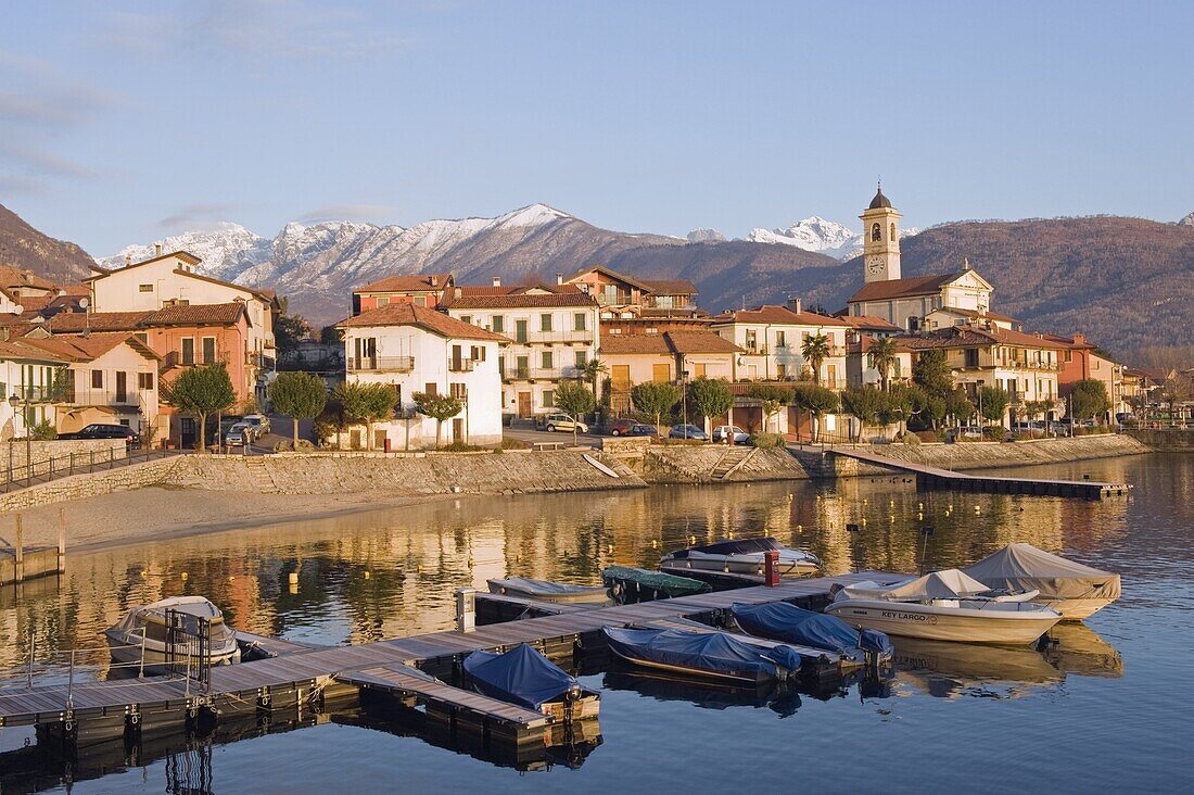 Boats and town houses on waterfront in Feriolo, Lake Maggiore, Italian Lakes, Piedmont, Italy, Europe