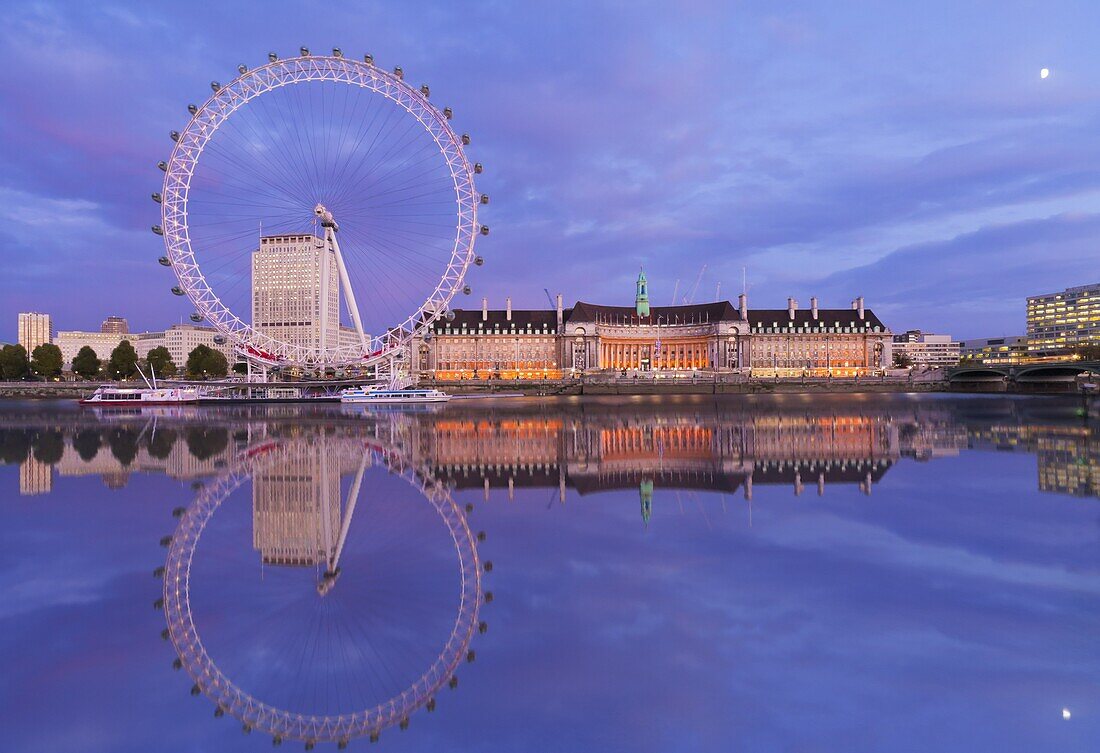 London Eye and Old County Hall reflected in the River Thames at twilight, London, England, United Kingdom, Europe