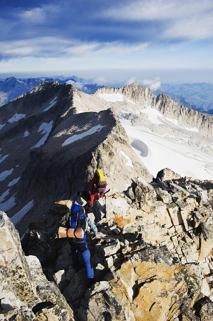 Climbers on summit of Pico de Aneto, at 3404m the highest peak in the Pyrenees, Spain, Europe