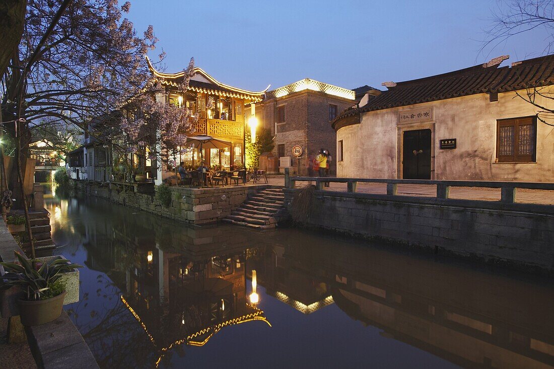 Teahouse at dusk along canal, Suzhou, Jiangsu, China, Asia