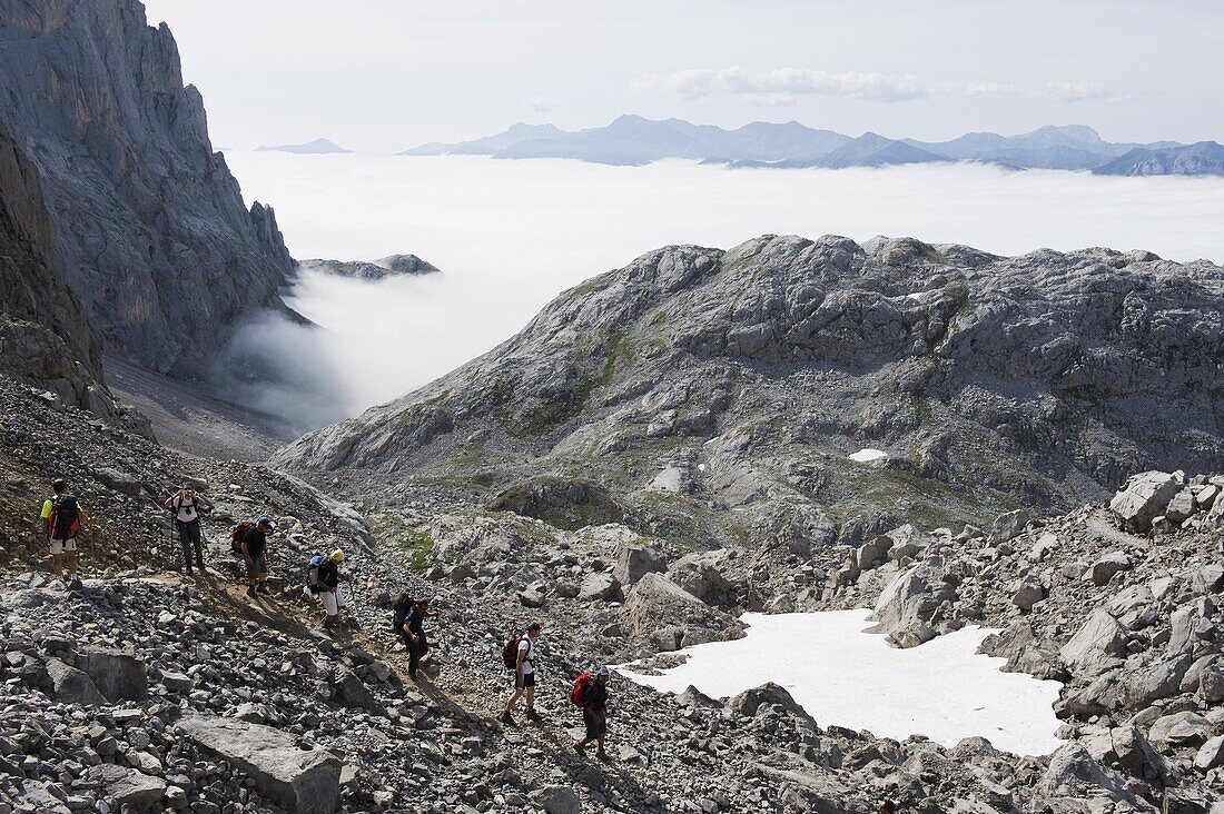 Hikers in the Picos de Europa National Park, shared by the provinces of Asturias, Cantabria and Leon, Spain, Europe