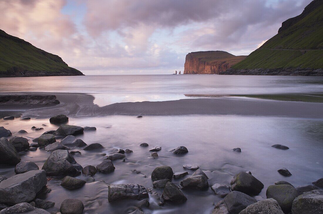 Risin and Kellingin sea stacks in the distance, from Tjornuvik bay, Streymoy, Faroe Islands (Faroes), Denmark, Europe