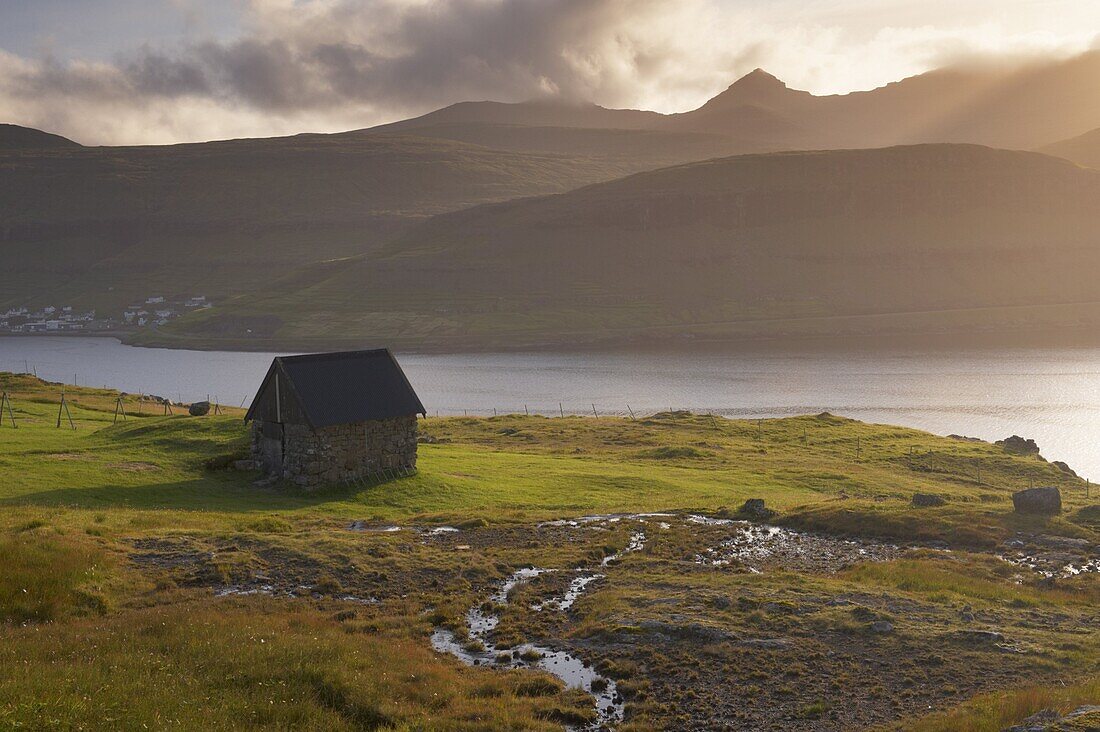 Streymoy mountains seen across Sundini sound, from near Eidi, on the north-west tip of Eysturoy, Faroe Islands (Faroes), Denmark, Europe