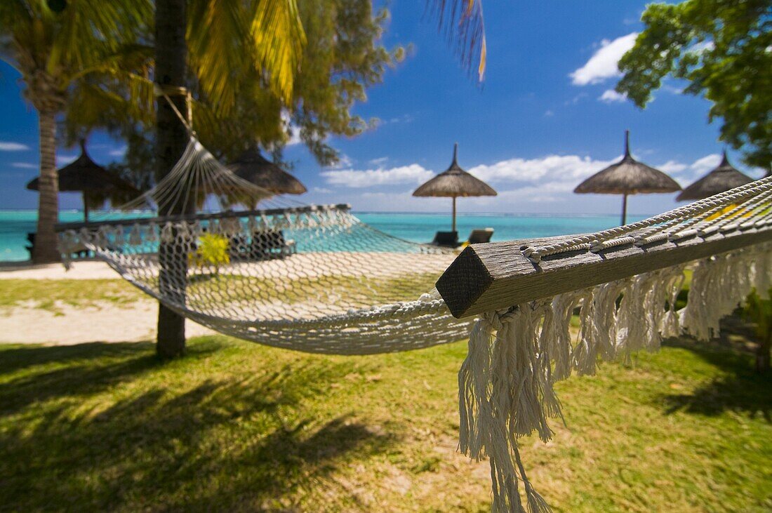 Hammock on the beach of the Beachcomber Le Paradis Hotel,  Mauritius,  Indian Ocean,  Africa