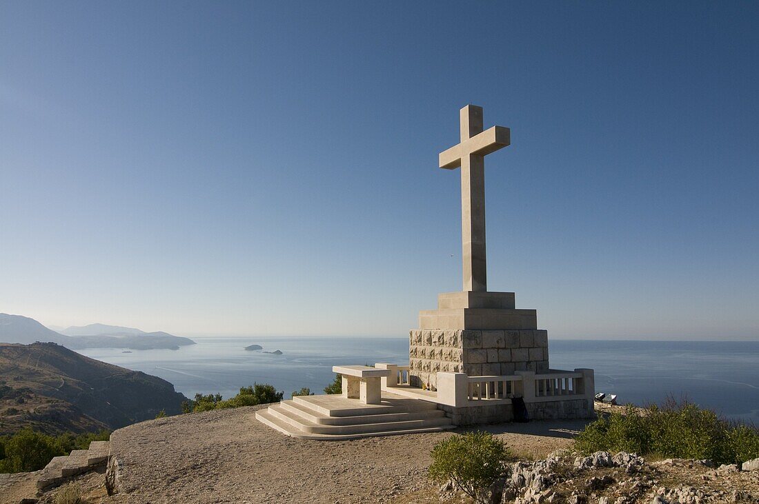 Huge Christian cross on top of the mountain above the old town of Dubrovnik,  Croatia,  Europe