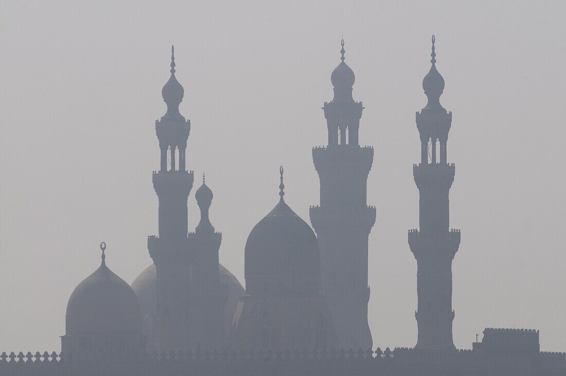 The minarets of the mosques of the old city in the smog,  Cairo,  Egypt,  North Africa,  Africa