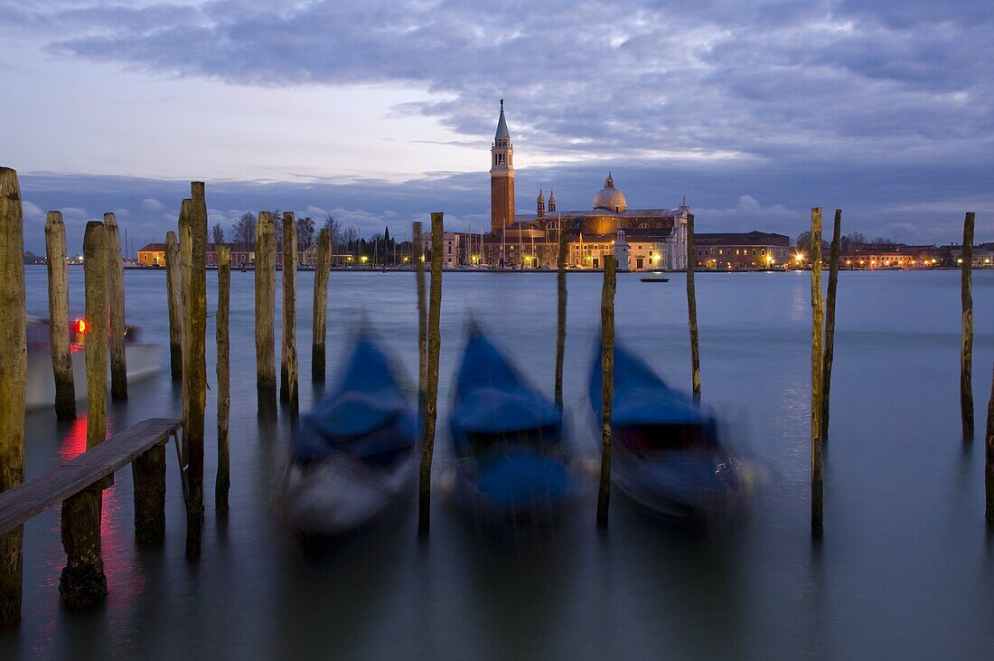 Gondolas at dusk and San Giorgio di Maggiore in the background, Venice, UNESCO World Heritage Site, Veneto, Italy, Europe