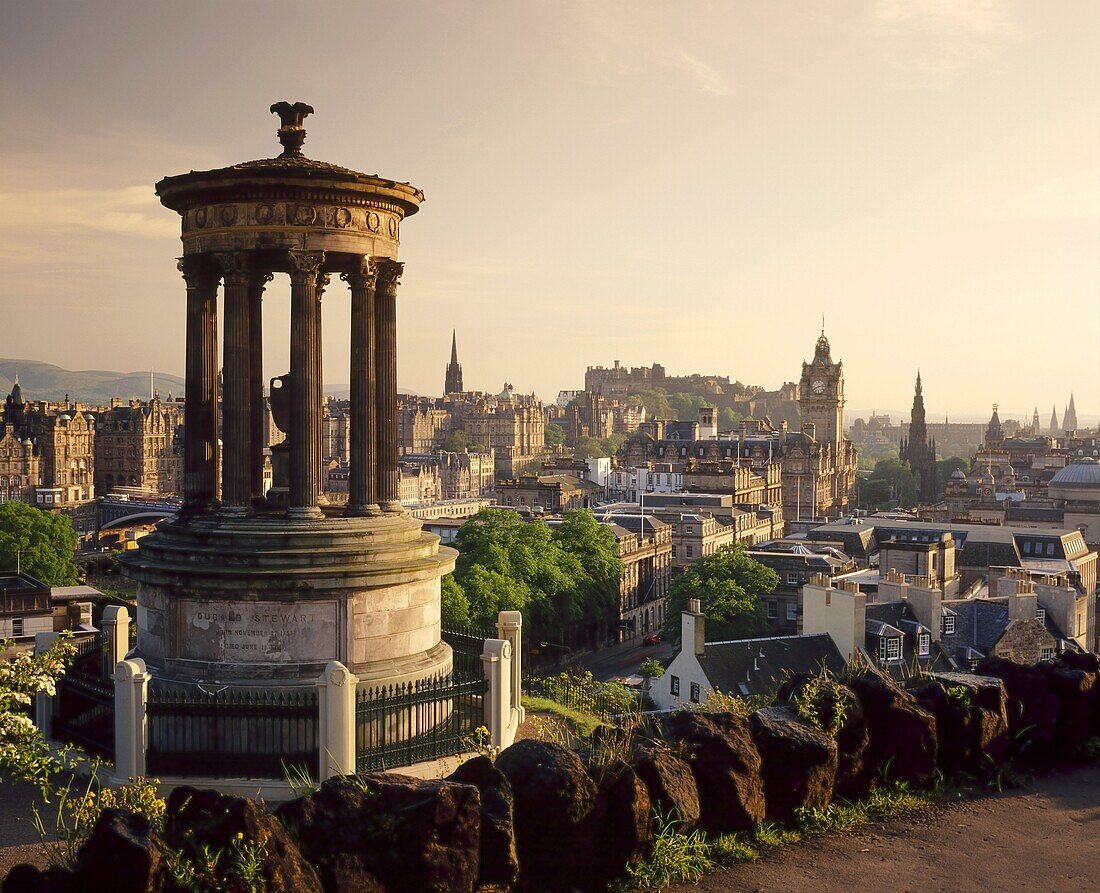 The Dugald Stewart Monument and view over Princes St. including the Waverley Hotel clock tower, Edinburgh, Lothian, Scotland, UK