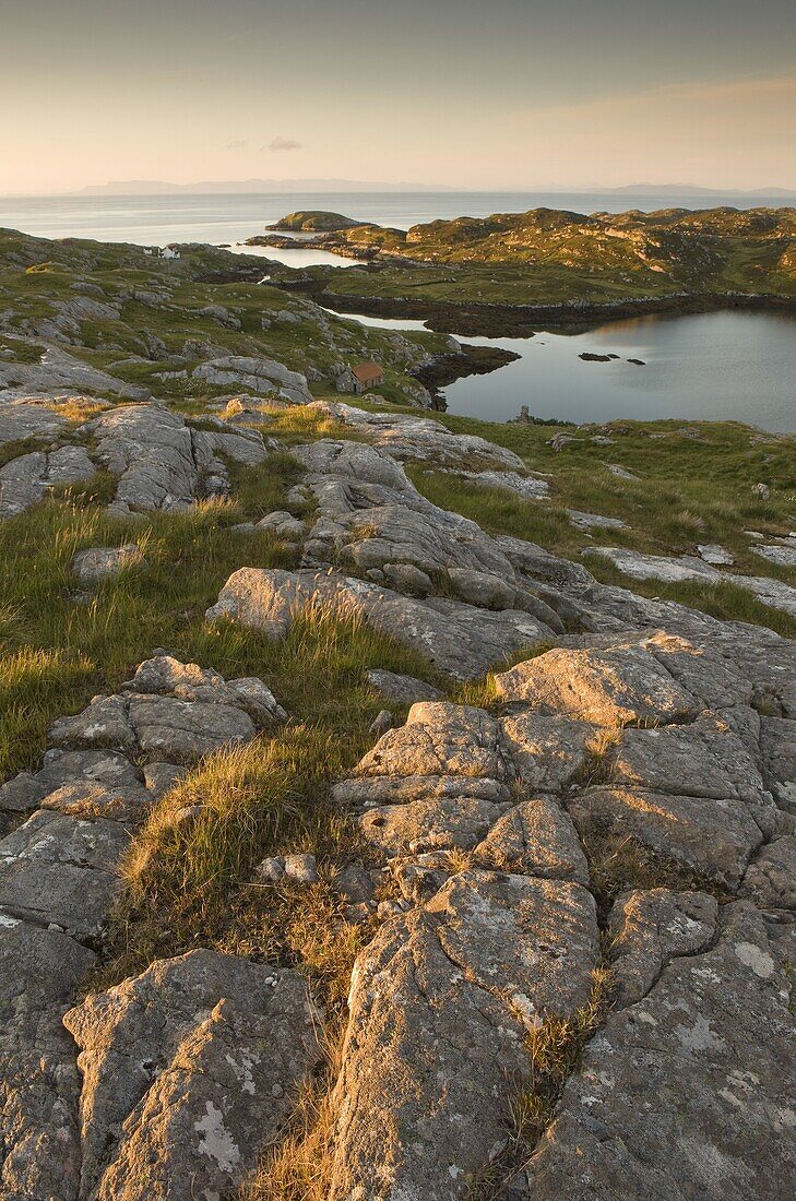 Rocky coasline bathed in early morning light at township of Manish, Isle of Harris, Outer Hebrides, Scotland, United Kingdom, Europe