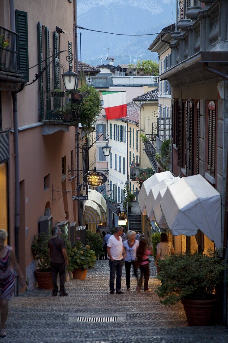 Shopping street at dusk, Bellagio, Lake Como, Lombardy, Italy, Europe