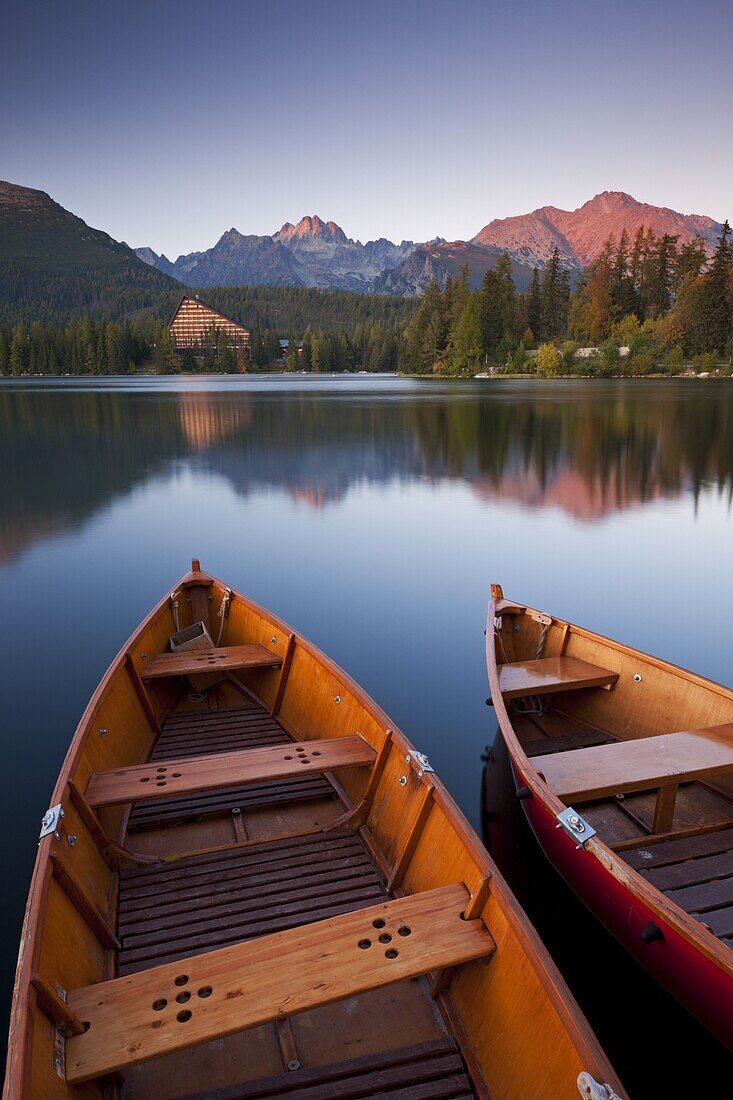 Wooden boats on Strbske Pleso lake in the Tatra Mountains, Slovakia, Europe