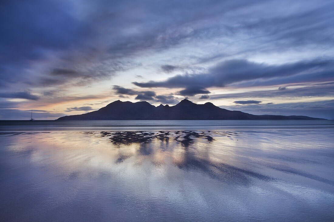 Dusk, looking to towards Rum from the Bay of Laig on Eigg, Inner Hebrides, Scotland, United Kingdom, Europe