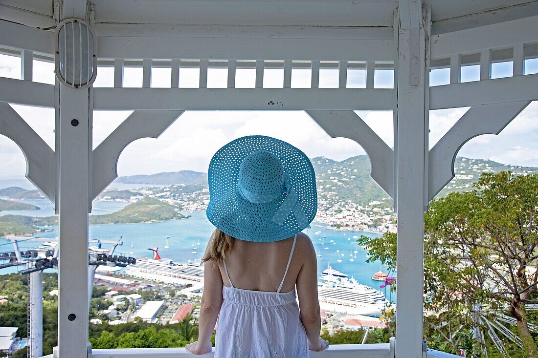 Young woman watching cruise ships in port, Charlotte Amalie, St. Thomas, U.S. Virgin Islands, West Indies, Caribbean, Central America