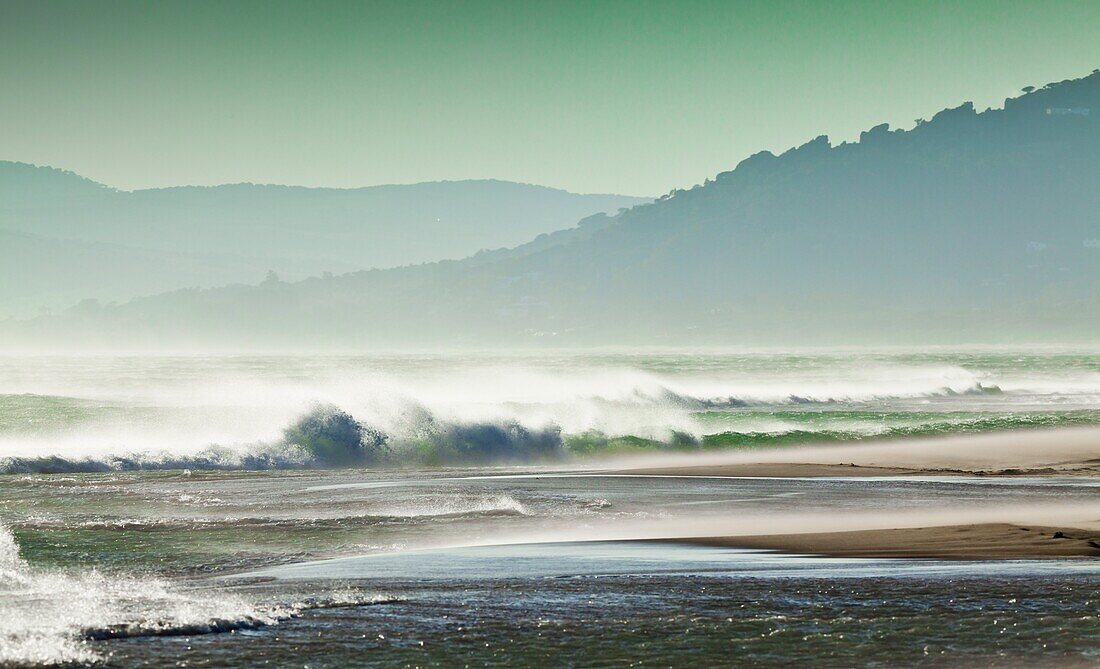 Storm force Levante winds blowing the tops of waves, Strait of Gibraltar, Estrecho Natural Park, Los Lanses beach, Tarifa, Costa de la Luz, Andalucia, Spain, Europe