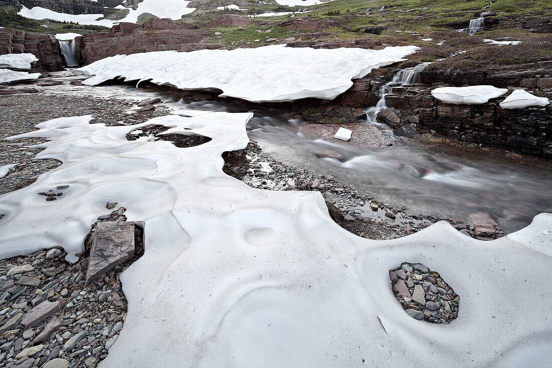 Alpine stream with snow, Glacier National Park, Montana, United States of America, North America