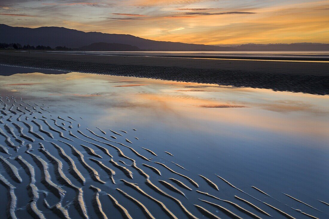 Ripples of sand on Pohara Beach at sunset, Golden Bay, South Island, New Zealand, Pacific