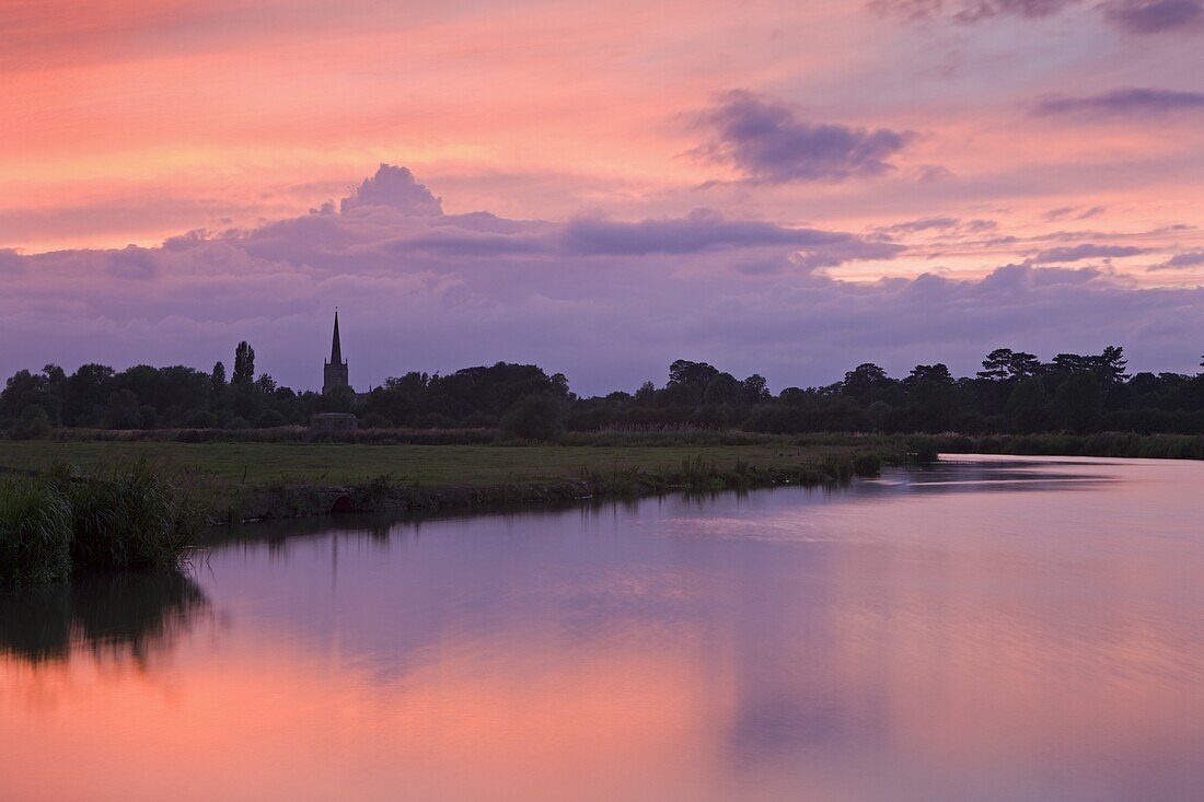 Beautiful sunset over the River Thames and the church spire of Lechlade, Oxfordshire, The Cotswolds, England, United Kingdom, Europe