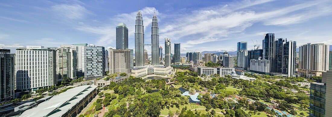 City centre including the KLCC park convention and shopping centre and the iconic 88 storey steel clad Petronas Towers, Kuala Lumpur, Malaysia, Southeast Asia, Asia