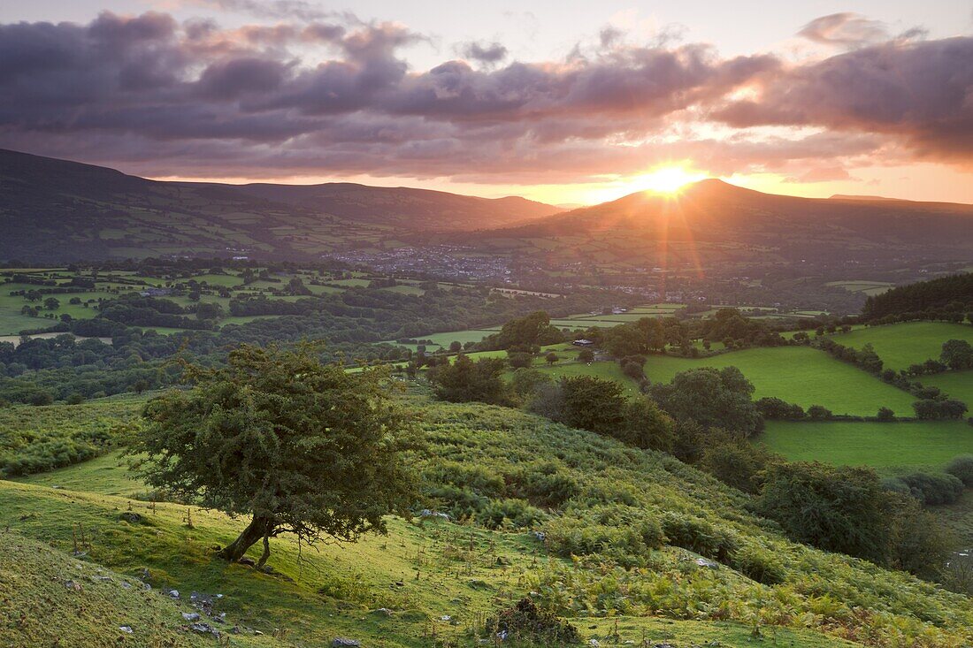 Sunrise over the Sugarloaf and town of Crickhowell, Brecon Beacons National Park, Powys, Wales, United Kingdom, Europe