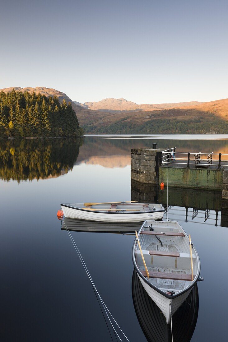 Rowing boats moored on Loch Katrine at Stronachlachar, Stirling, Scotland, United Kingdom, Europe