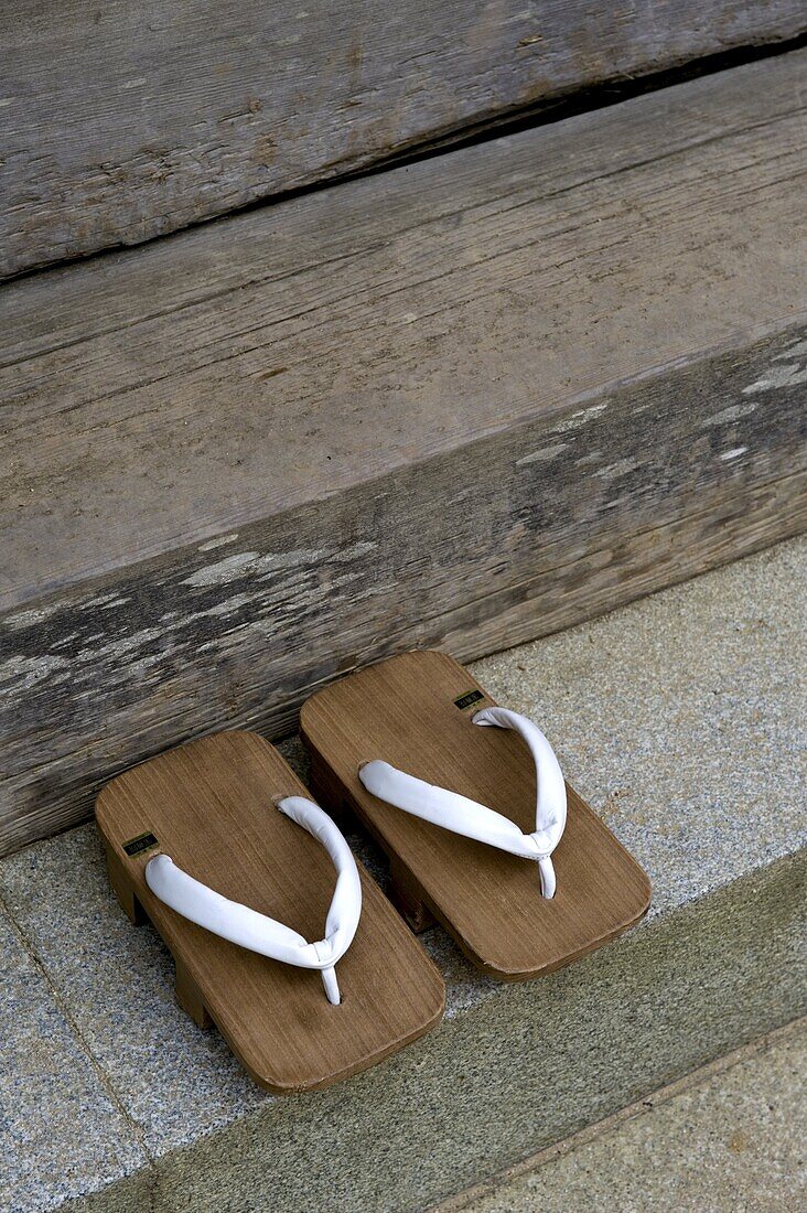 Pair of traditional wooden monk's geta (sandals) at the steps of a Buddhist temple on Mount Koya, Wakayama, Japan, Asia