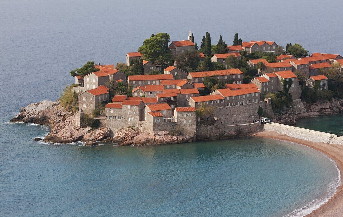 Beach and houses on the hotel island at Sveti Stefan on the Adriatic coast, Sveti Stefan, Montenegro, Europe
