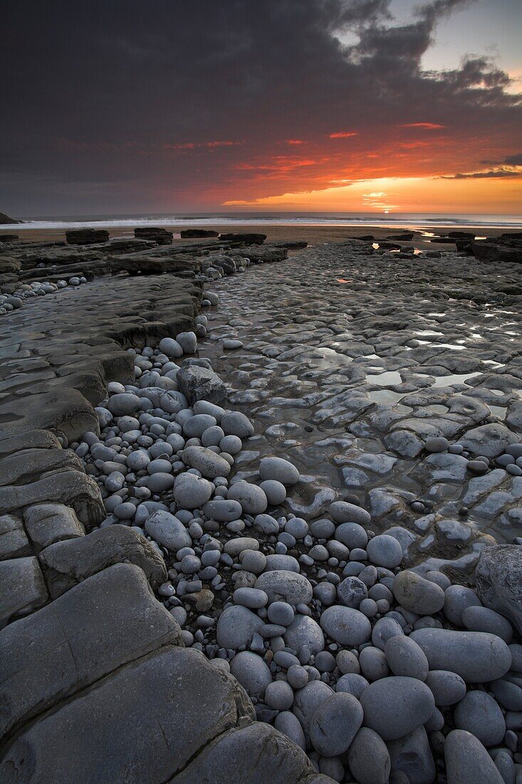 Rock ledges and pebbles at Dunraven Bay, Southerndown, Wales, United Kingdom, Europe