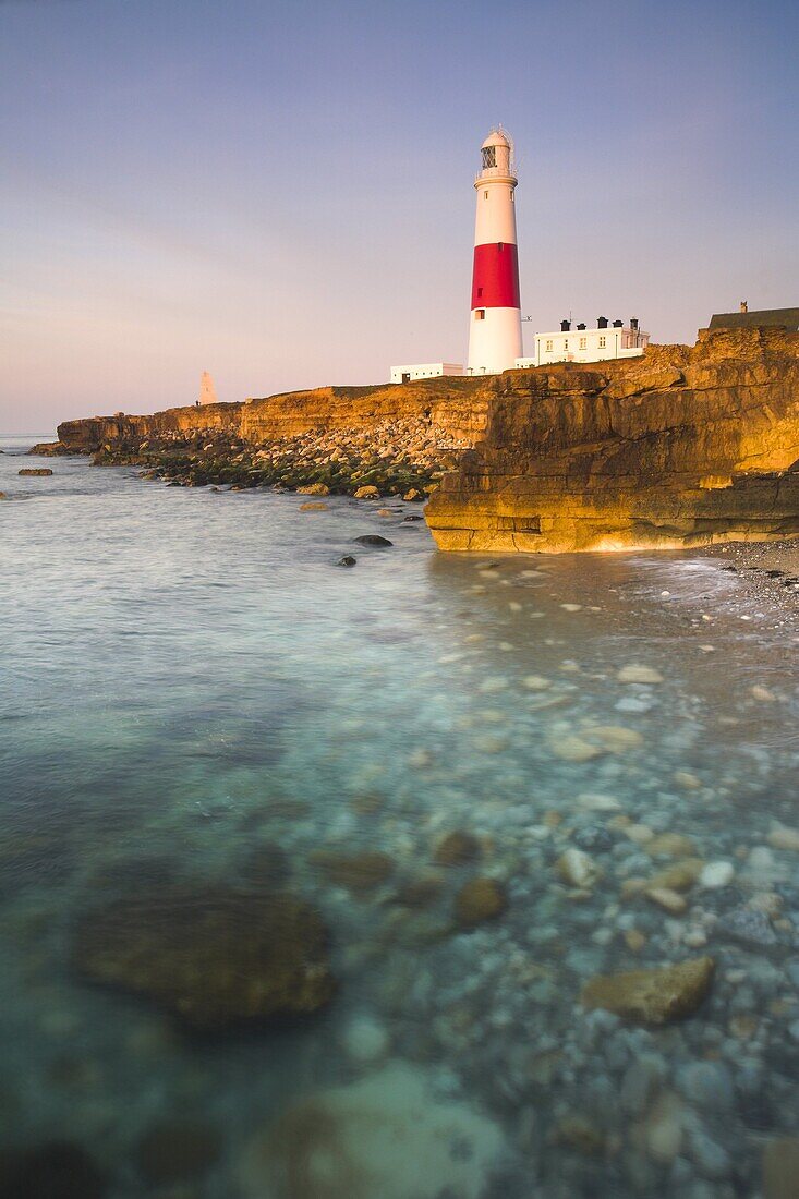 Early morning sunshine lights up Portland Bill lighthouse, Portland, Jurassic Coast, UNESCO World Heritage Site, Dorset, England, United Kingdom, Europe