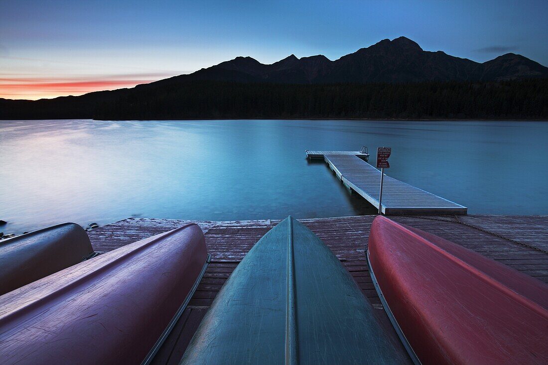 Canoes pulled up on the jetty at Patricia Lake, Jasper National Park, UNESCO World Heritage Site, Alberta, Rocky Mountains, Canada, North America