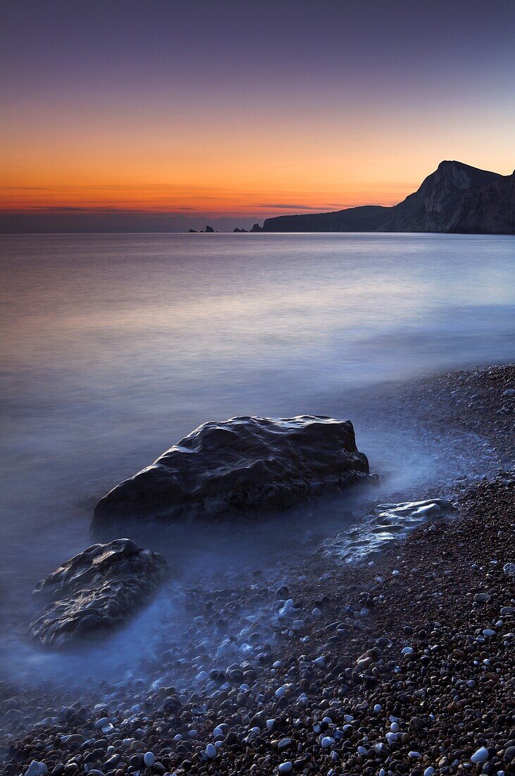 Twilight on the pebbly beach at Worbarrow Bay,Jurassic Coast, UNESCO World Heritage Site, Dorset, England, United Kingdom, Europe