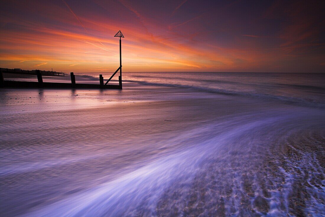 Surging tide at dawn on a Hayling Island beach, Hampshire, England, United Kingdom, Europe