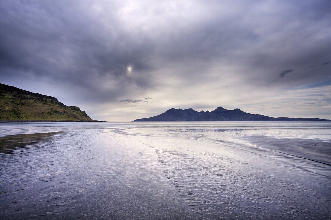 Early evening view towards Rum from the Bay of Laig on the Isle of Eigg, Hebrides, Scotland, United Kingdom, Europe