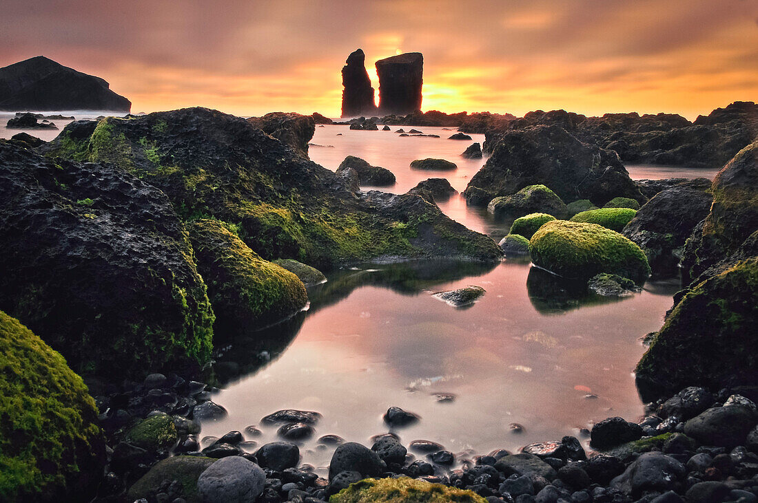 Beach with lava pools and rocks near Mosteiros at sunset, view to volcanic islands, Sao Miguel, Azores, Portugal, Europe, Atlantic Ocean