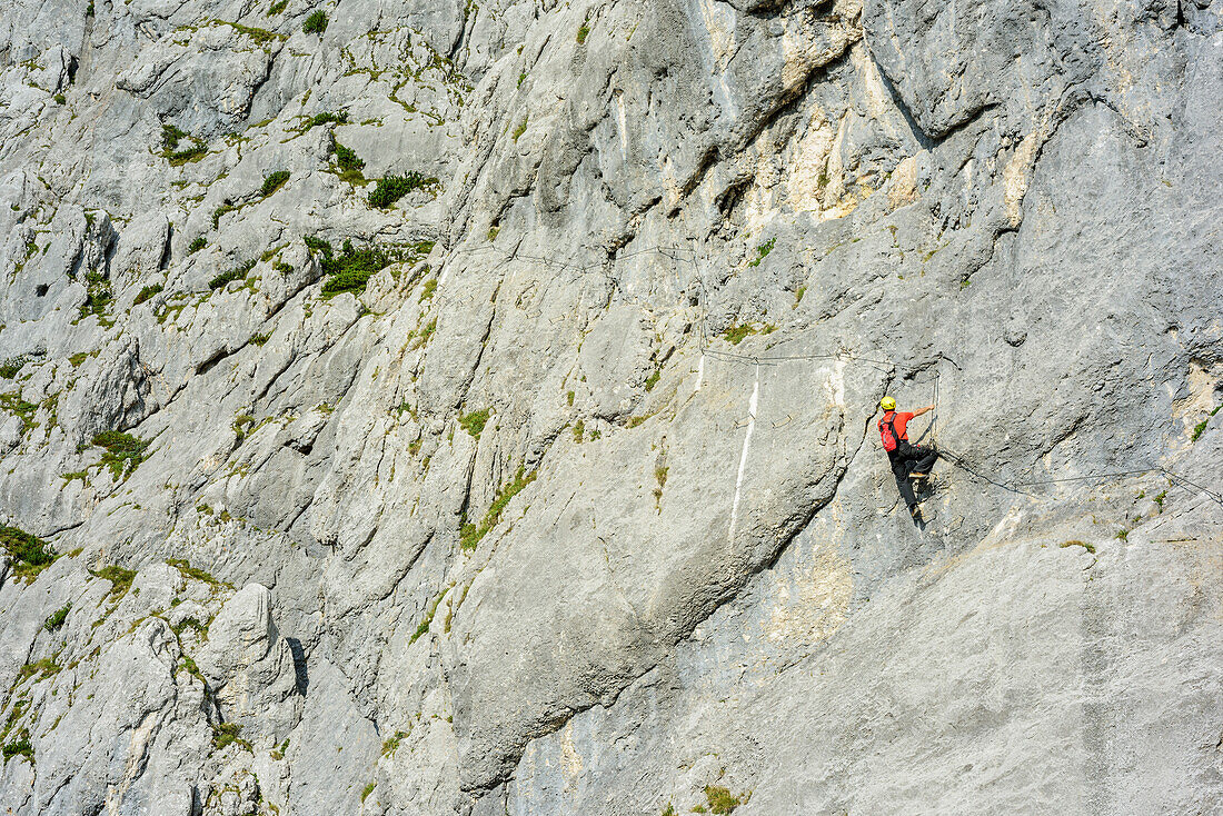 Man ascending fixed rope route, Hochthronklettersteig, fixed rope route Hochthron, Untersberg, Berchtesgadener Hochthron, Berchtesgaden Alps, Upper Bavaria, Bavaria, Germany