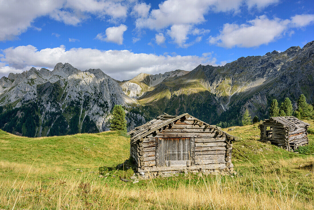 Old hay stacks with Marmolada range in background, Vallaccia, Vallaccia range, Marmolada, Dolomites, UNESCO World Heritage Dolomites, Trentino, Italy