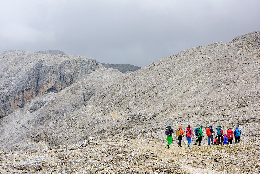 Several persons hiking on Pala plateau, Pala range, Dolomites, UNESCO World Heritage Dolomites, Trentino, Italy