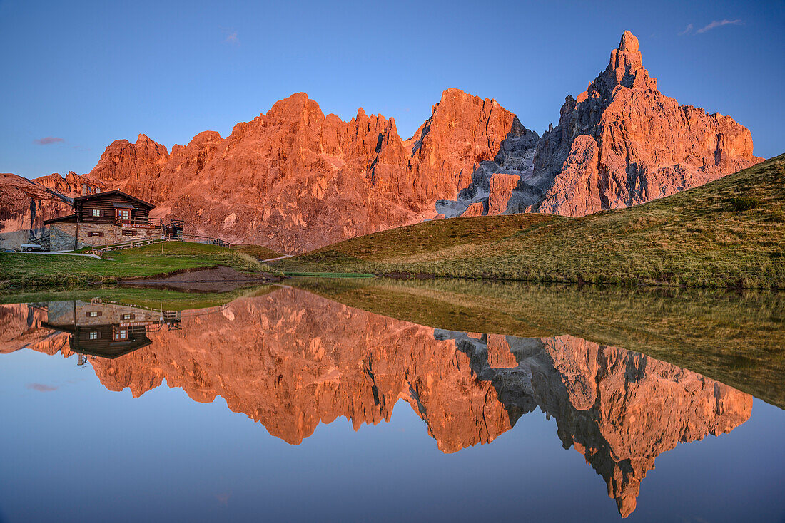 Baita Segantini, Cima del Focobon, Cima di Val Grande, Cima dei Bureloni, Cima della Vezzana and Cimon della Pala reflecting in lake, Pala range, Dolomites, UNESCO World Heritage Dolomites, Trentino, Italy