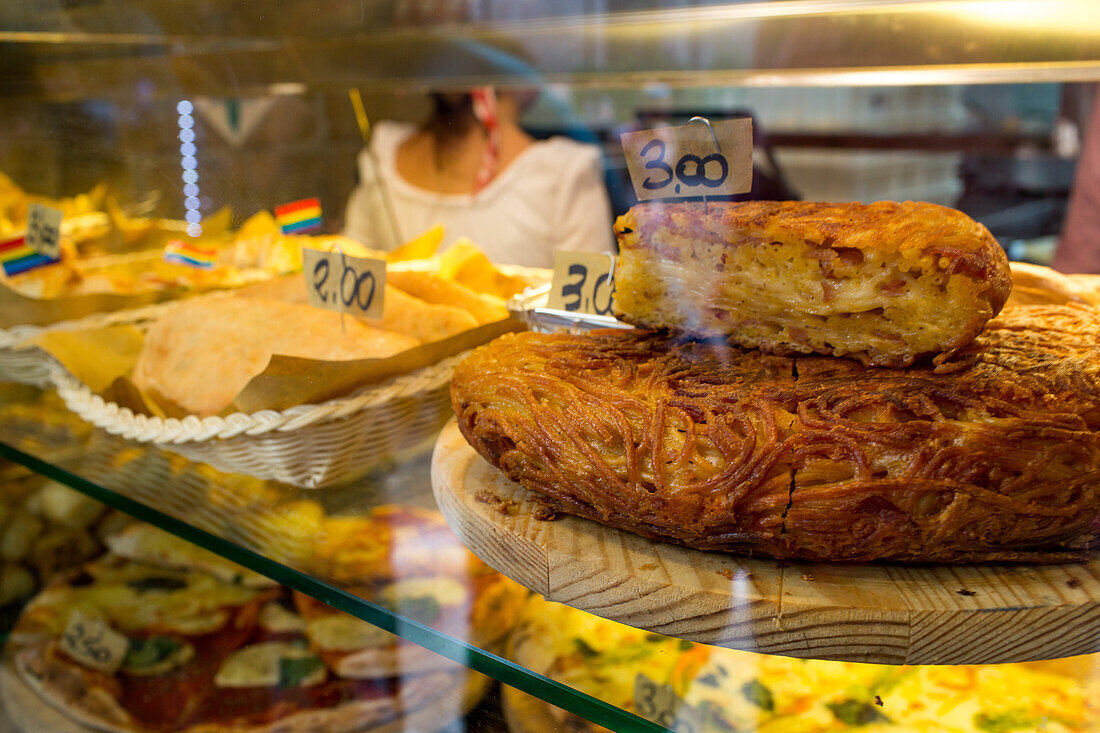 fried spaghetti cake, food, display counter, Campania, Naples, Napoli, Italy