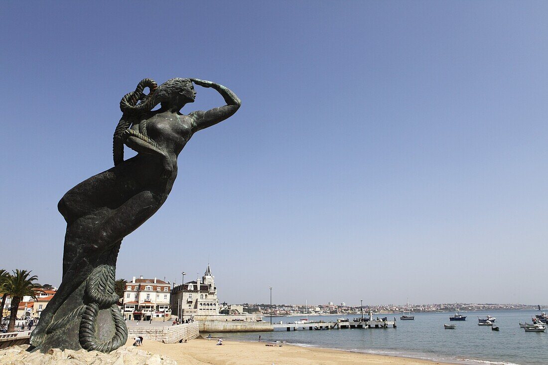 Nautical statue of a female figure looking towards the Atlantic Ocean at Ribeira Beach, Cascais, near Lisbon, Portugal, Europe