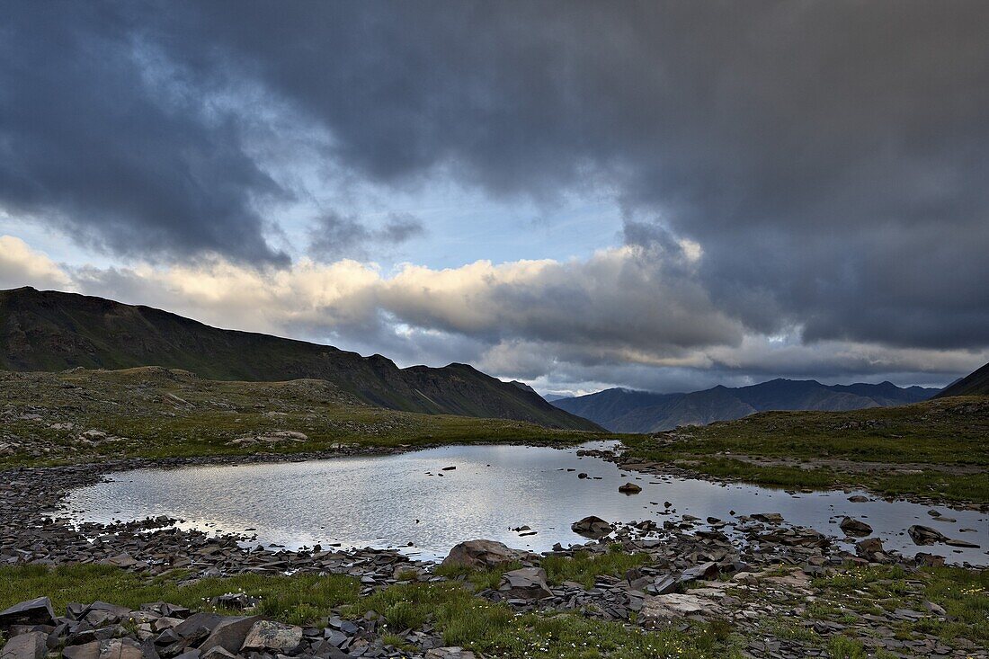 Cloudy sky above an Alpine tarn, San Juan National Forest, Colorado, United States of America, North America