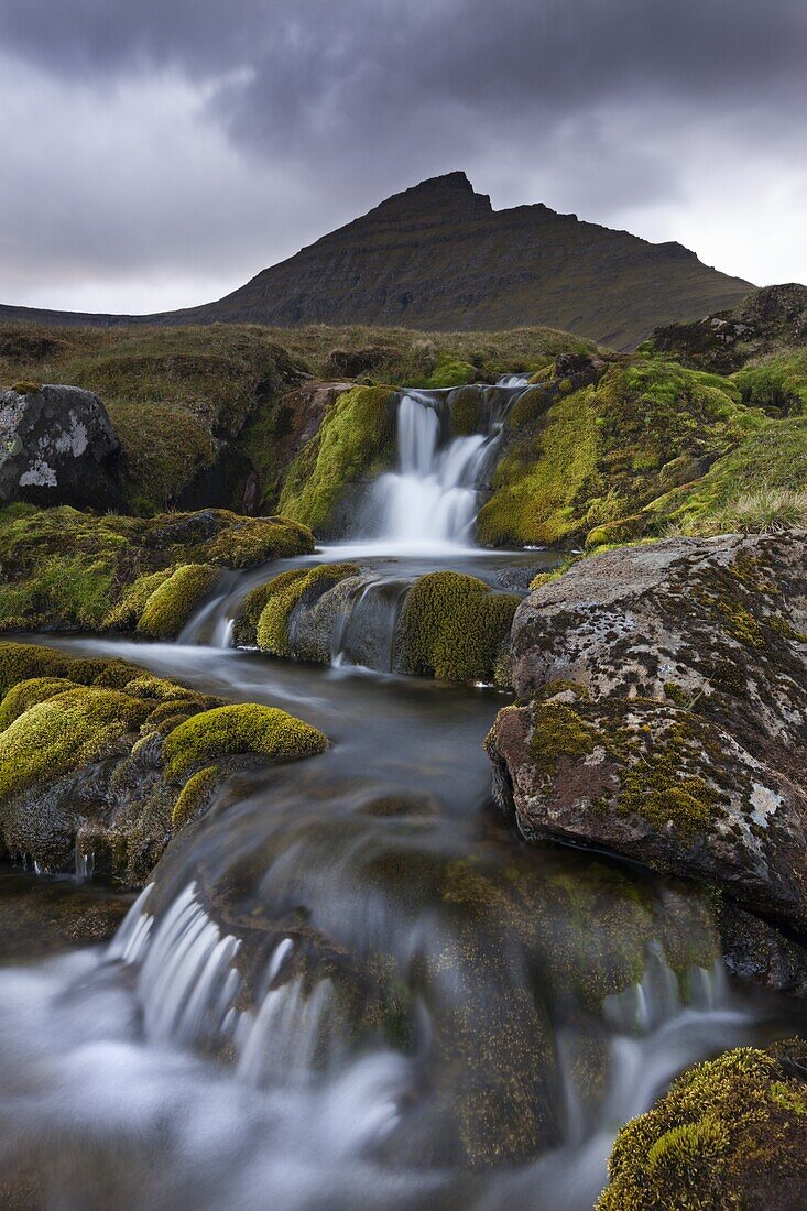 Rocky stream with waterfalls below Slaettaratindur mountain, Eysturoy, Faroe Islands, Denmark, Europe