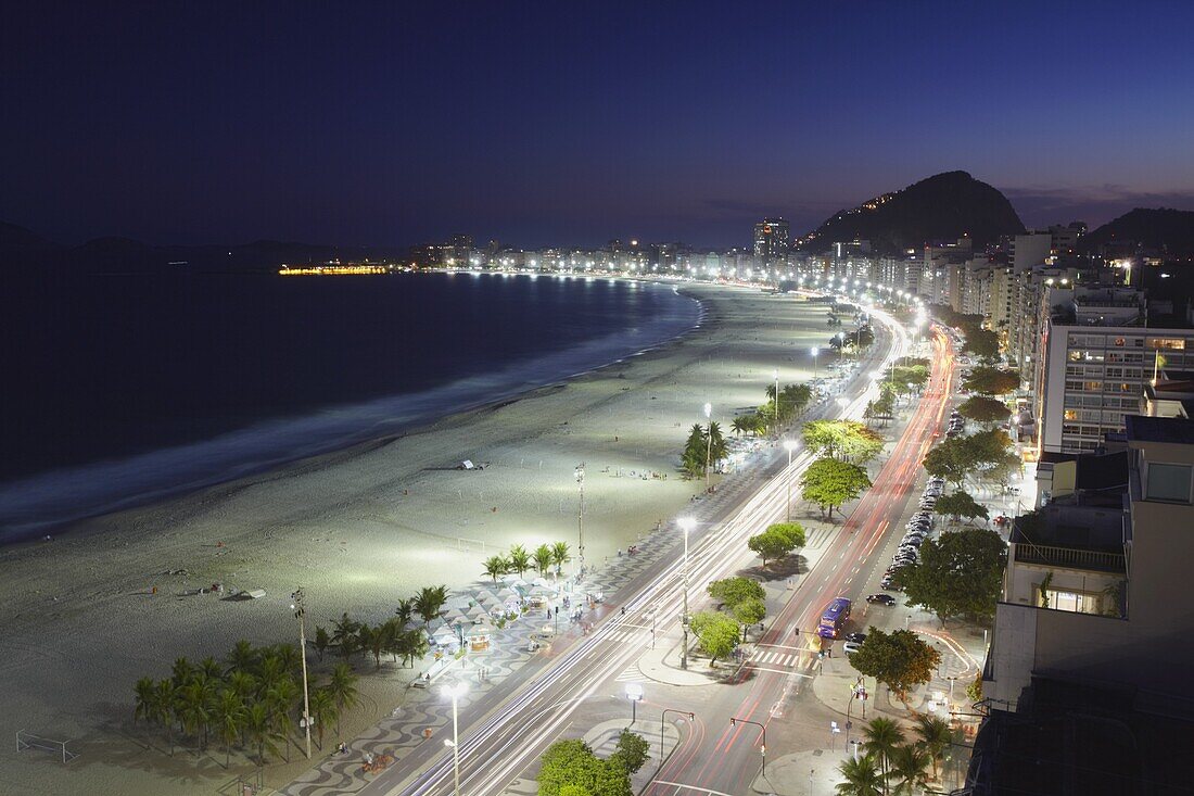 View of Copacabana beach and Avenida Atlantica at dusk, Copacabana, Rio de Janeiro, Brazil, South America