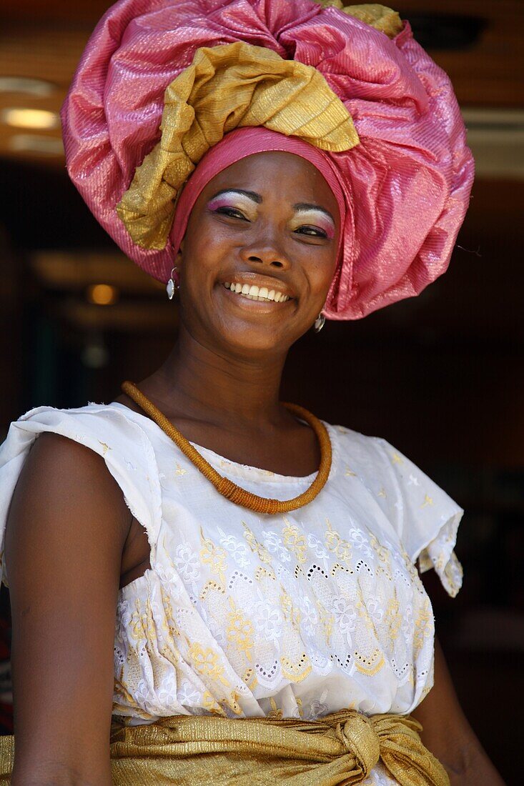 Portrait of a Bahian woman in traditional dress at the Pelourinho district, Salvador (Salvador de Bahia), Bahia, Brazil, South America