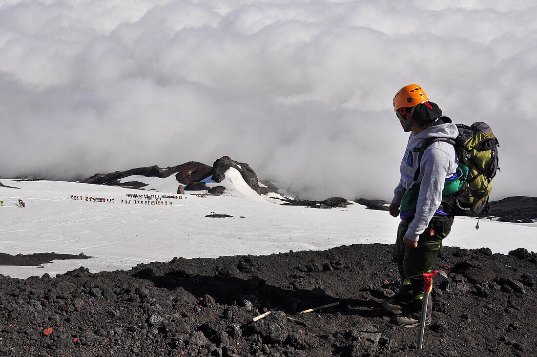 Mountain climber at volcano Villarrica, Strato volcano, sunset, National Park Villarrica, Pucon, Región de la Auracania, Region Los Rios,  Patagonia, Andes, Chile, South America