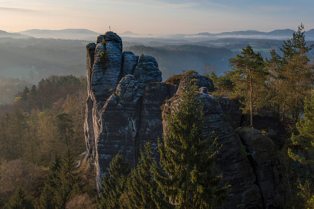 Wehlgrund valley with view to rock formations and mountains at sunset with fog, Neurathen Castle, Bastei, Rathen, Elbe Sandstone Mountains, Saxon Switzerland, Saxony, Germany